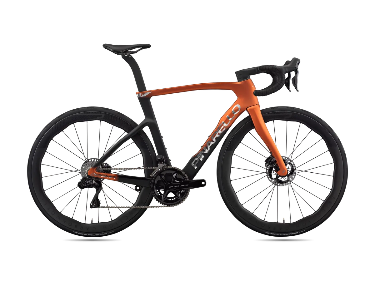 An orange Pinarello Dogma F road bike, side view, with the parts checked in a service labelled